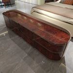 Luxury Bed End Cabinet with Natural Wood Veneer Drawer Fronts Upholstered Top and Stainless Steel Trim